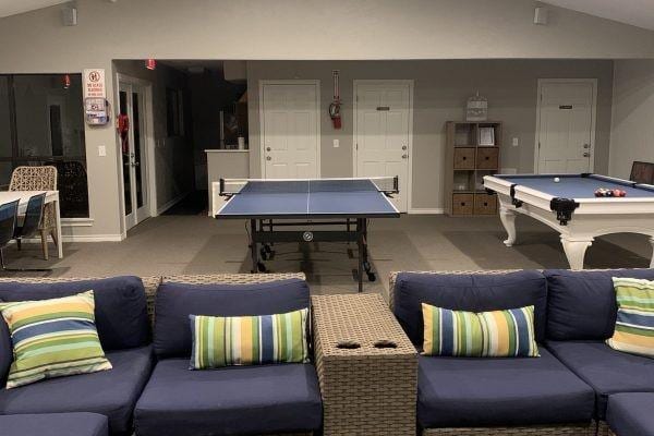 game room featuring baseboards, carpet floors, pool table, and vaulted ceiling