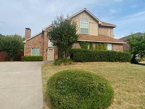 front facade with a front yard