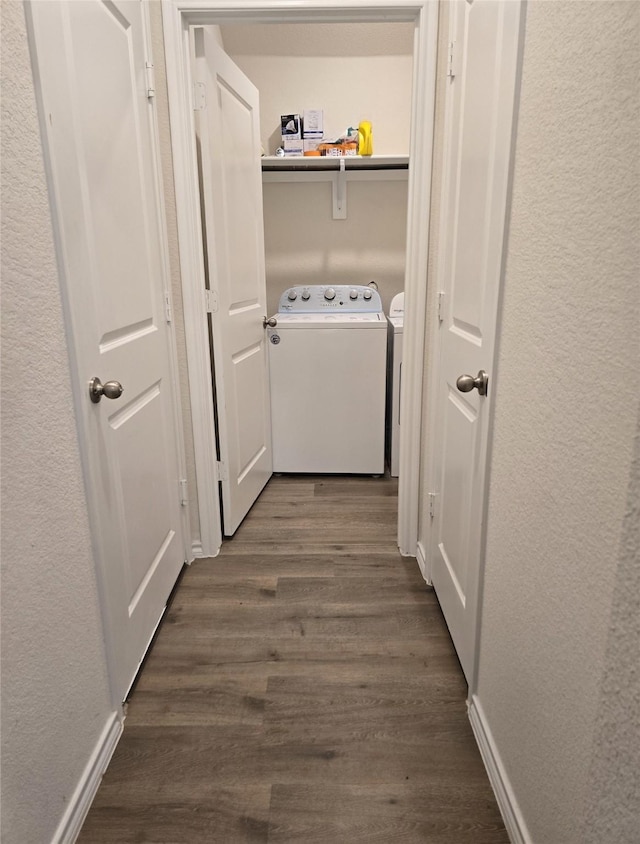 washroom featuring washer and dryer and dark wood-type flooring