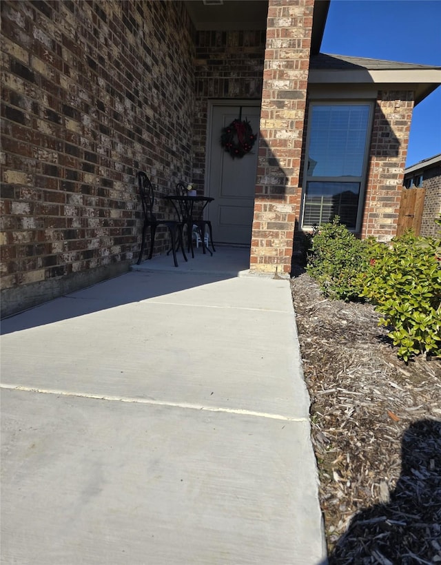 property entrance featuring a patio