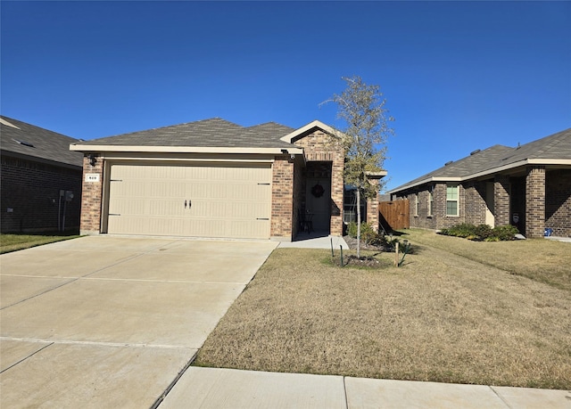 single story home with a garage and a front yard