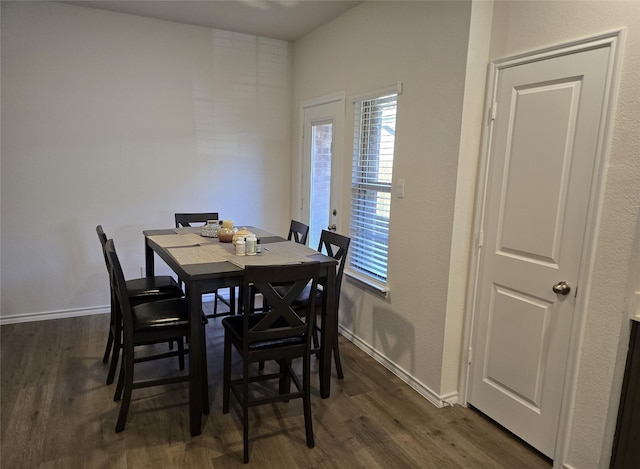 dining area with dark wood-type flooring