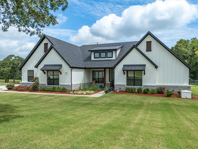 modern inspired farmhouse featuring a front lawn