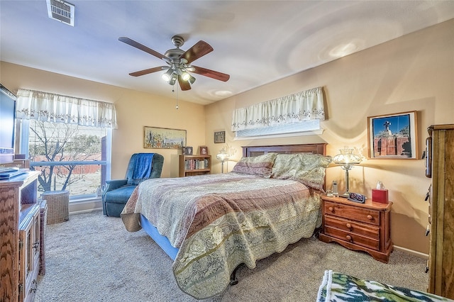 bedroom featuring ceiling fan and carpet