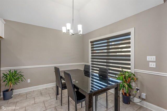 tiled dining room with vaulted ceiling and a chandelier