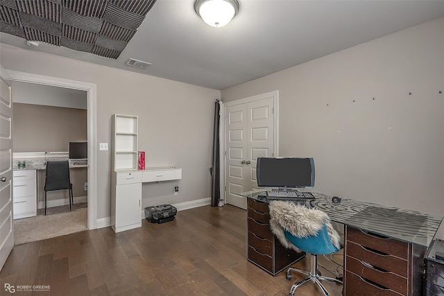 office with dark hardwood / wood-style floors