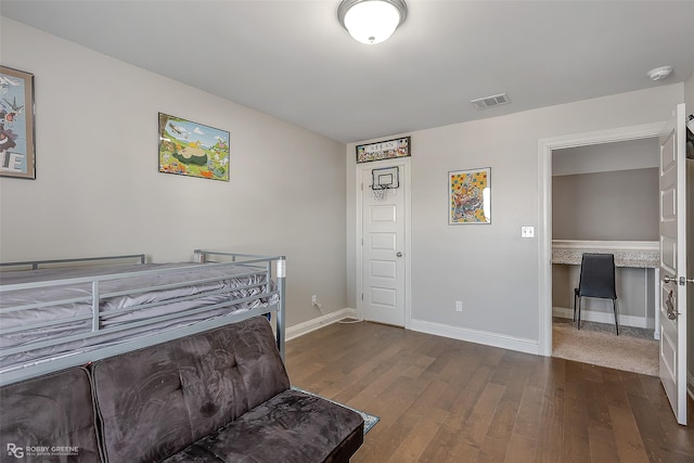 bedroom featuring dark hardwood / wood-style floors