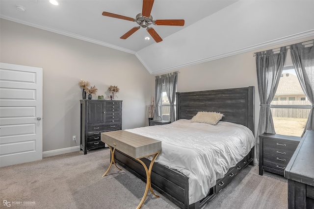 carpeted bedroom with vaulted ceiling, ornamental molding, and ceiling fan