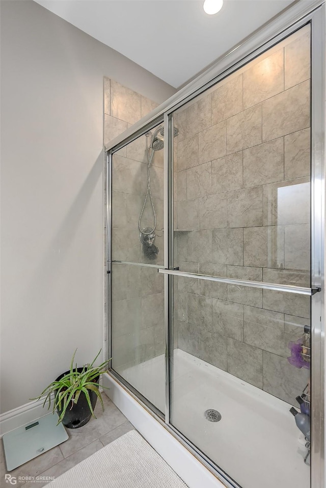 bathroom with a shower with shower door