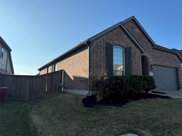 view of property exterior featuring a yard and a garage