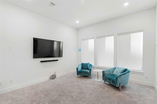 sitting room featuring carpet flooring