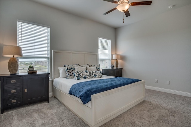 bedroom featuring light carpet and ceiling fan