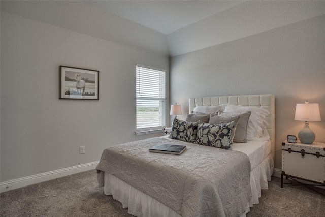 carpeted bedroom with vaulted ceiling