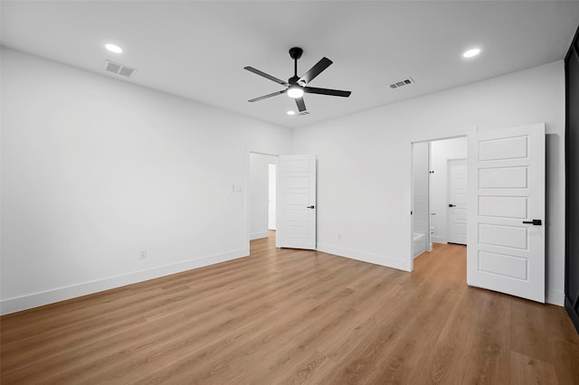 unfurnished bedroom with ceiling fan and light hardwood / wood-style floors