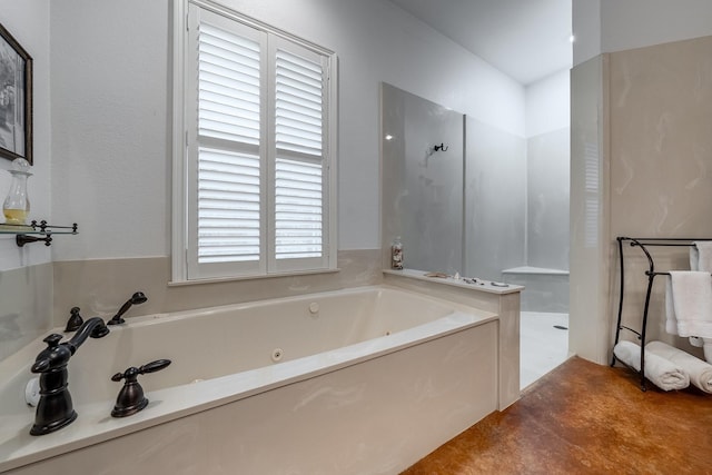 bathroom featuring separate shower and tub