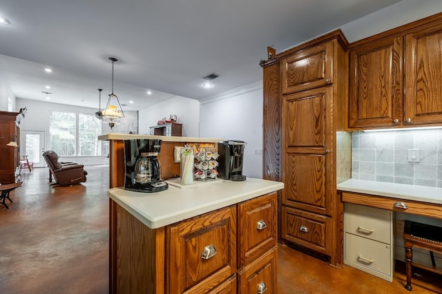 kitchen featuring tasteful backsplash, a center island, and decorative light fixtures