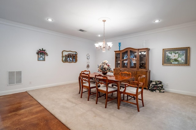 dining room with crown molding, light carpet, and an inviting chandelier