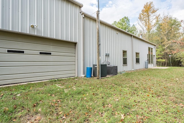 view of home's exterior featuring a lawn and cooling unit