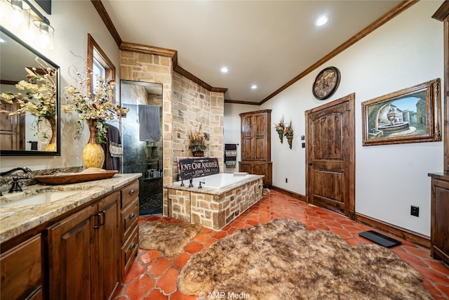 bathroom featuring crown molding, vanity, a fireplace, and separate shower and tub