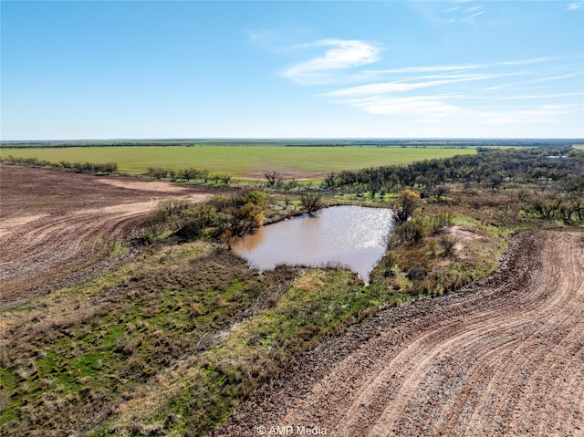 aerial view with a rural view and a water view