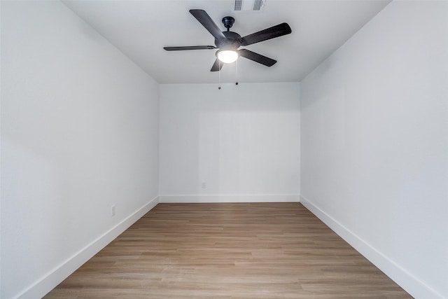 unfurnished room with ceiling fan and light wood-type flooring