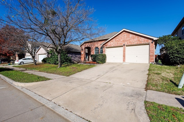 ranch-style house featuring a garage and a front lawn