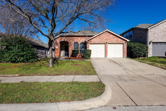 view of front of home with a garage and a front yard