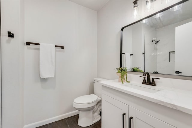 bathroom with a shower, toilet, and vanity