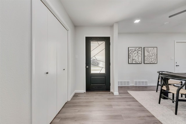 foyer with light hardwood / wood-style flooring