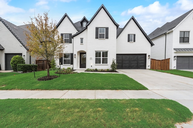 view of front of house with a front yard and a garage