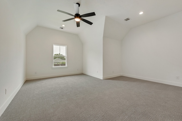 bonus room featuring light carpet, lofted ceiling, and ceiling fan