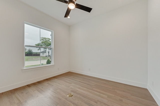 unfurnished room with ceiling fan and light wood-type flooring