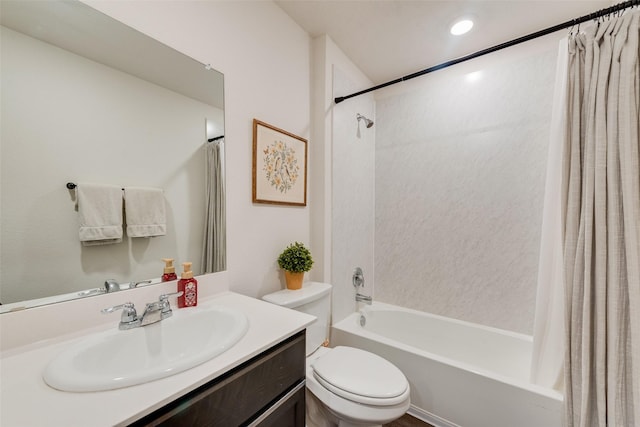 full bath featuring toilet, shower / bath combo with shower curtain, and vanity