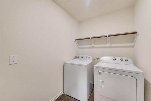 laundry room with dark wood-style floors, laundry area, baseboards, and separate washer and dryer