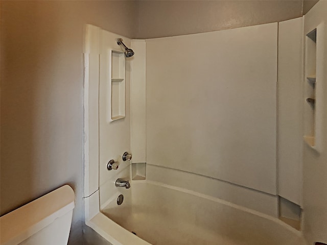 bathroom with shower / bathtub combination and toilet