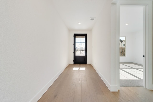 doorway to outside with light hardwood / wood-style flooring