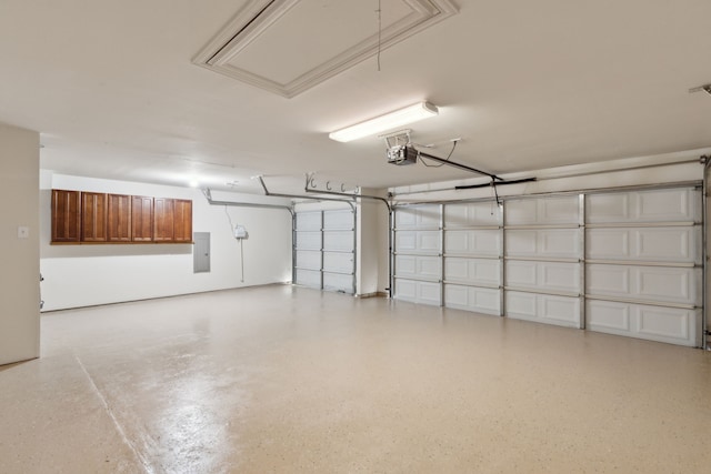 garage with electric panel and a garage door opener