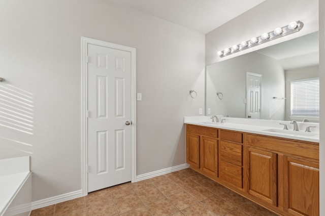 bathroom with vanity, a tub to relax in, and tile patterned floors