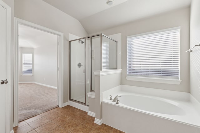 bathroom featuring tile patterned floors, independent shower and bath, and vaulted ceiling