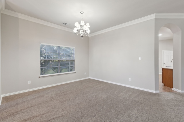 carpeted empty room featuring an inviting chandelier and crown molding