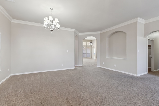 carpeted spare room featuring ceiling fan with notable chandelier and ornamental molding