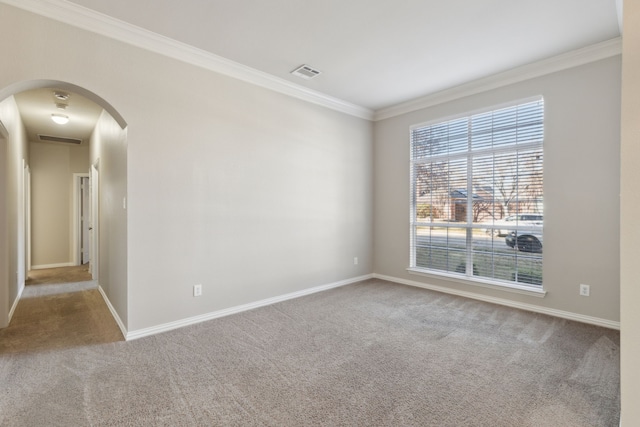 carpeted empty room with crown molding