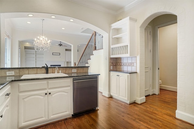 kitchen featuring dishwasher, sink, dark hardwood / wood-style flooring, white cabinets, and ceiling fan with notable chandelier