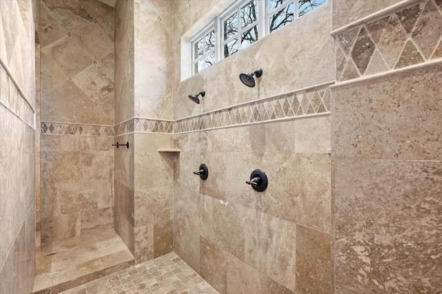 bathroom with tiled shower