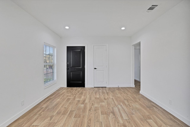 spare room with light wood-type flooring