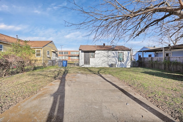 back of property featuring a yard