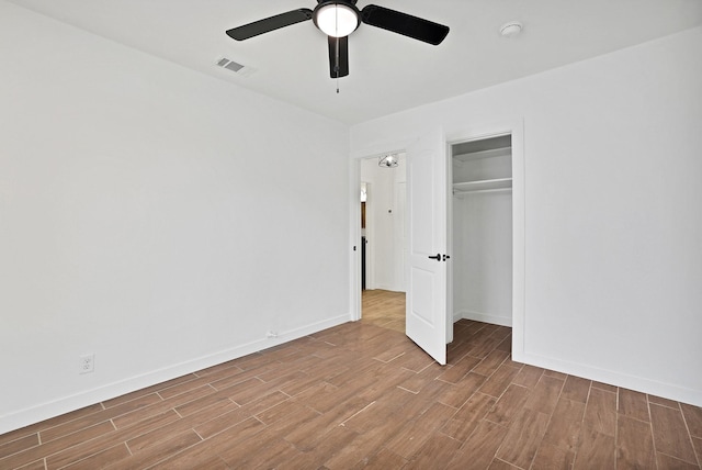 unfurnished bedroom with a closet and ceiling fan