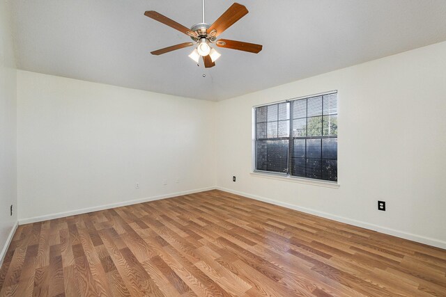 unfurnished room featuring vaulted ceiling, light hardwood / wood-style flooring, and ceiling fan