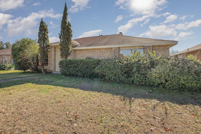 view of property exterior with a yard