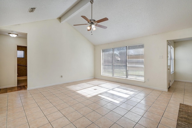 unfurnished room featuring light tile patterned floors, vaulted ceiling with beams, a textured ceiling, and ceiling fan